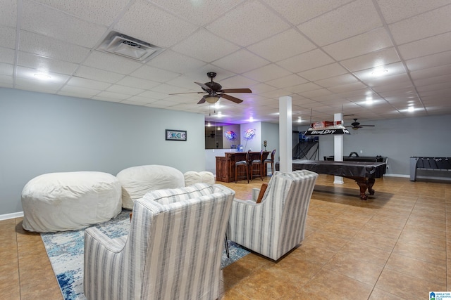 living room with tile patterned flooring, ceiling fan, billiards, and bar area