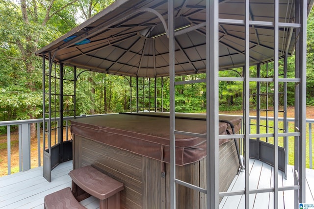 wooden terrace with a hot tub