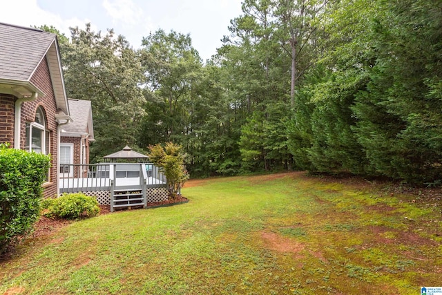 view of yard featuring a gazebo and a deck