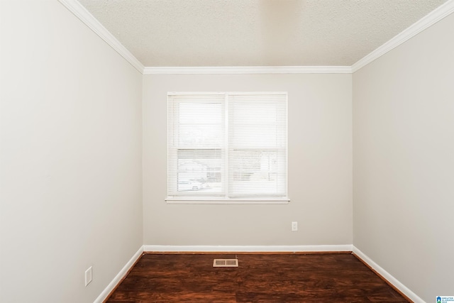 spare room with crown molding, a textured ceiling, and hardwood / wood-style flooring