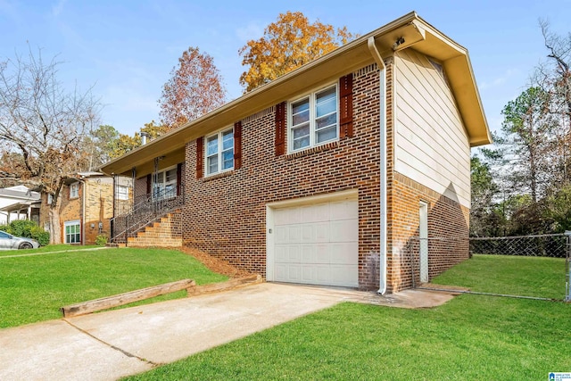 view of front of house with a front yard and a garage