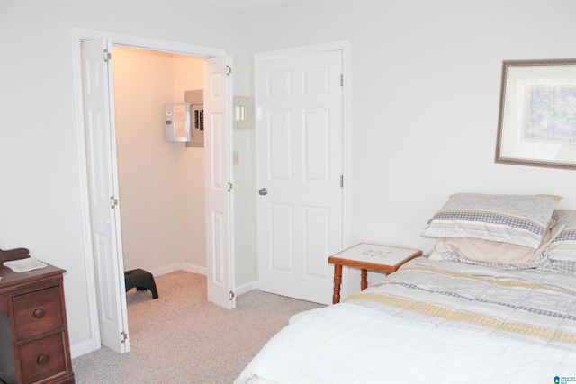 bedroom featuring light colored carpet