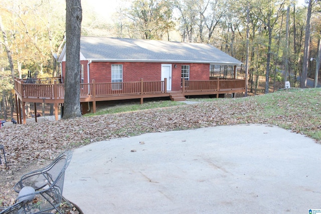 back of property featuring a deck