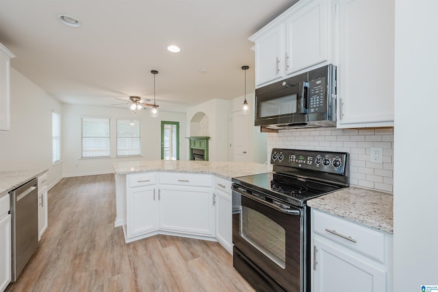 kitchen with ceiling fan, black appliances, pendant lighting, light hardwood / wood-style flooring, and white cabinetry