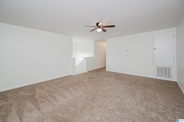 spare room featuring carpet floors and ceiling fan