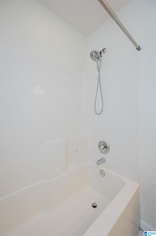 bathroom featuring washtub / shower combination