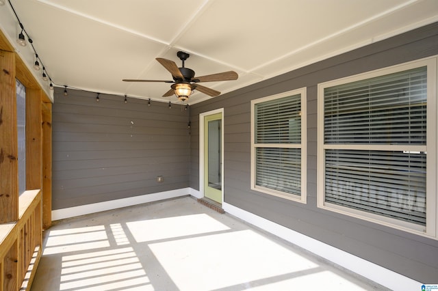 exterior space featuring ceiling fan