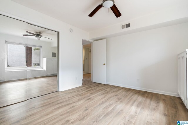 spare room with light hardwood / wood-style flooring