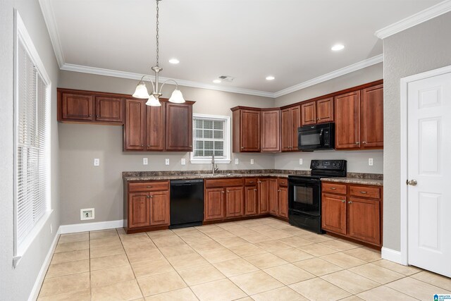 kitchen featuring a notable chandelier, crown molding, pendant lighting, light tile patterned floors, and black appliances