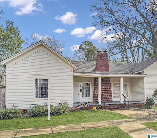 single story home featuring a front yard and a porch