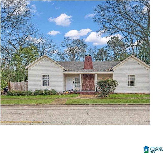 ranch-style house with a front lawn