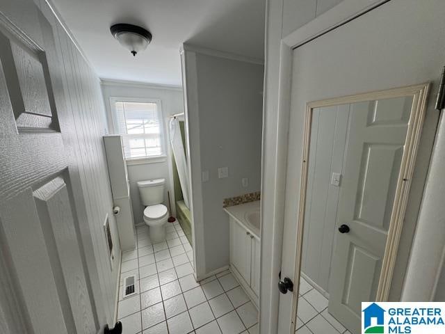 bathroom with a shower with curtain, tile patterned flooring, crown molding, toilet, and vanity