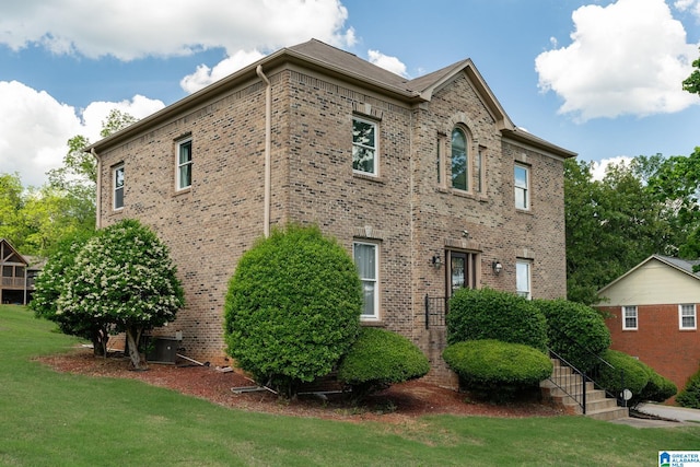 view of property exterior with a lawn