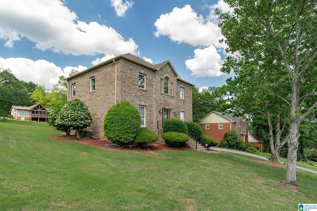 view of home's exterior featuring a lawn