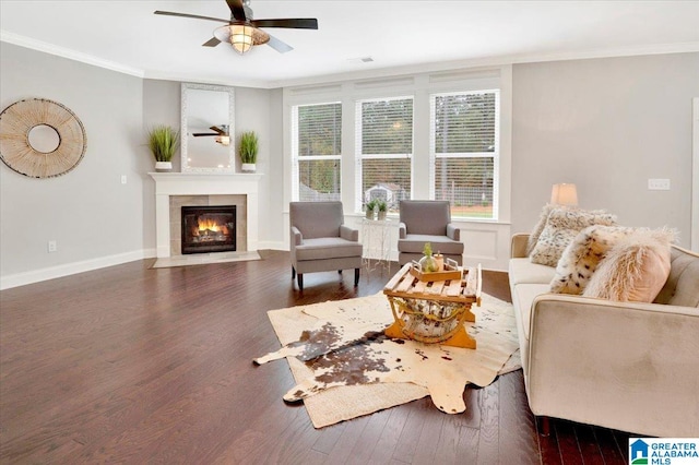 living room featuring ceiling fan, dark hardwood / wood-style flooring, and ornamental molding