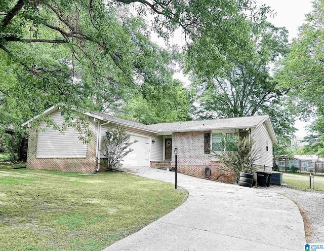 ranch-style house with a garage and a front lawn