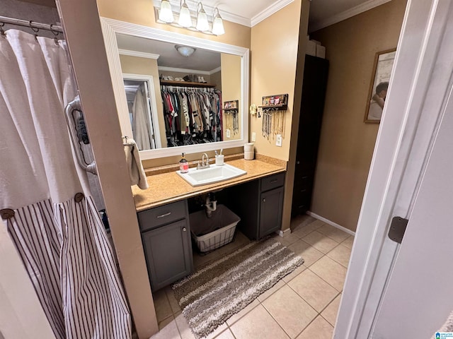 bathroom featuring tile patterned flooring, vanity, and ornamental molding