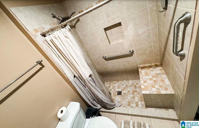 bathroom with toilet and walk in shower