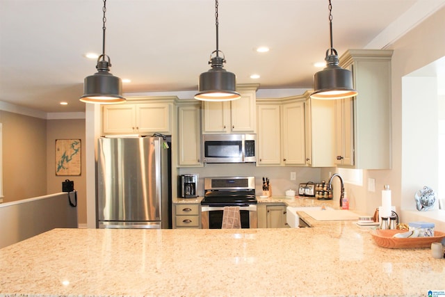 kitchen featuring light stone countertops, cream cabinets, decorative light fixtures, and appliances with stainless steel finishes