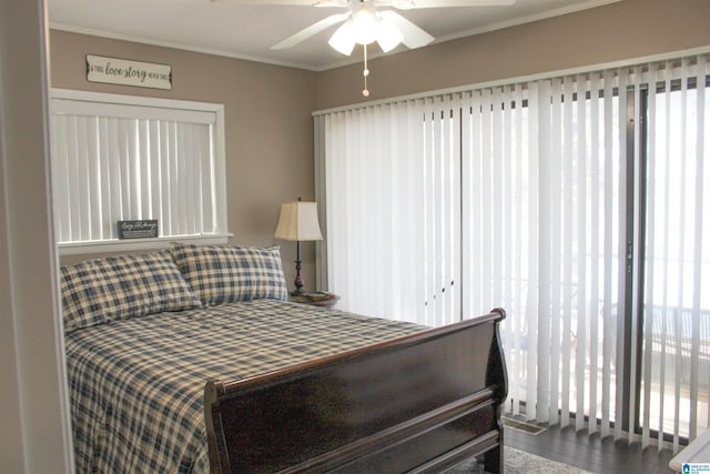 bedroom with ceiling fan and ornamental molding