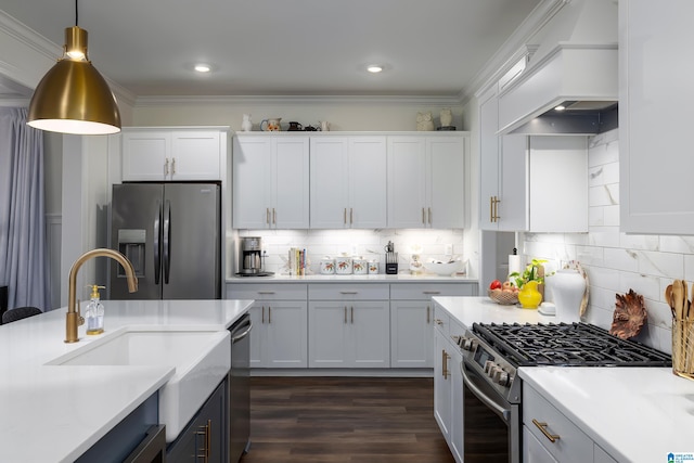 kitchen with custom exhaust hood, crown molding, appliances with stainless steel finishes, dark hardwood / wood-style flooring, and white cabinetry