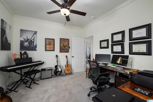 carpeted office with ceiling fan and crown molding