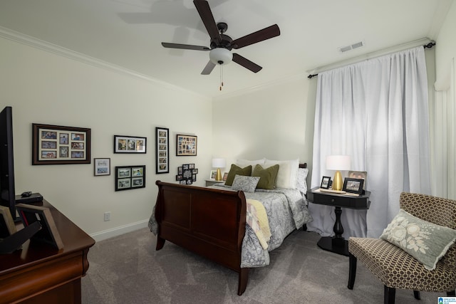 carpeted bedroom featuring ceiling fan and crown molding