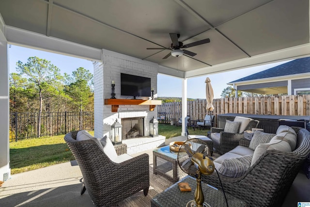 view of patio / terrace with an outdoor living space with a fireplace and ceiling fan