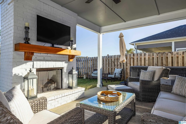 view of patio / terrace with an outdoor brick fireplace