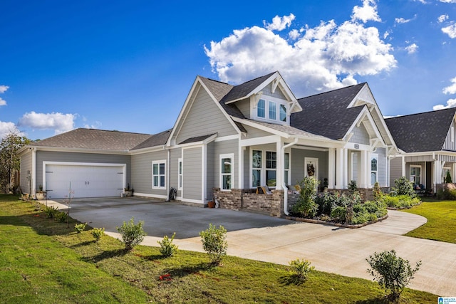 craftsman inspired home with a front yard and a garage