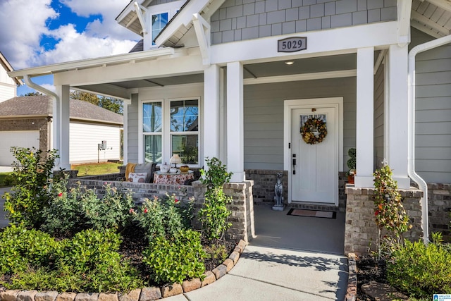 entrance to property featuring a porch