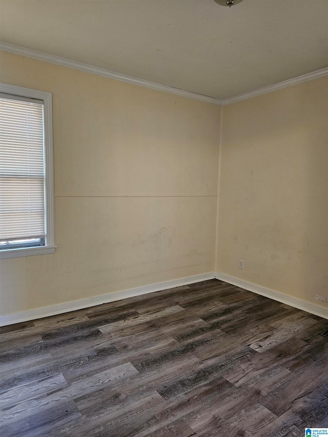 unfurnished room with crown molding and dark hardwood / wood-style floors