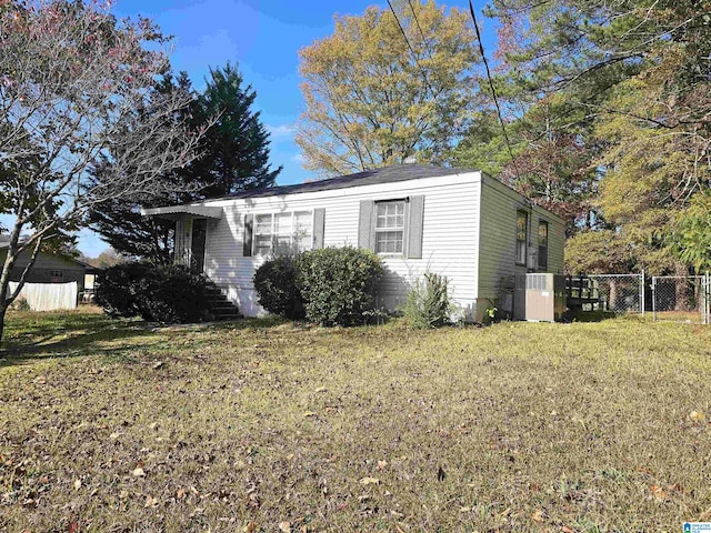 view of side of home featuring a yard