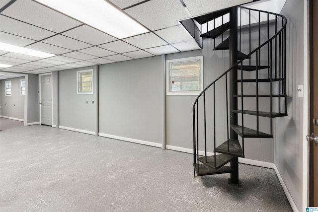 basement featuring a drop ceiling