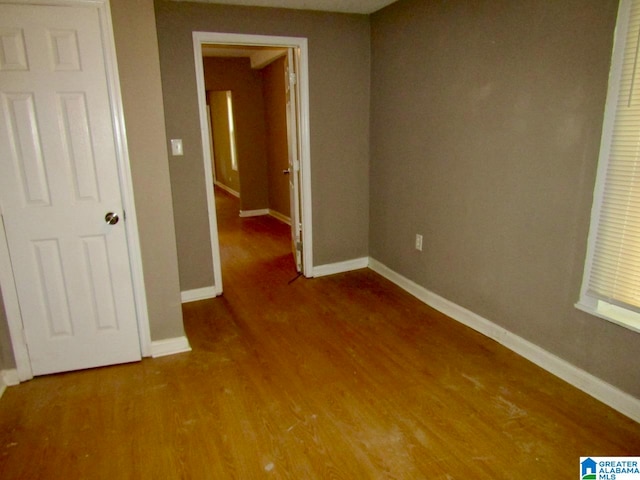 unfurnished bedroom with wood-type flooring