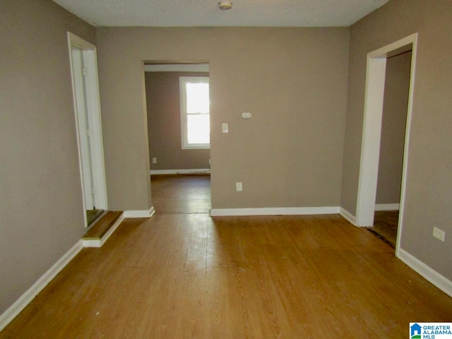 empty room featuring hardwood / wood-style flooring