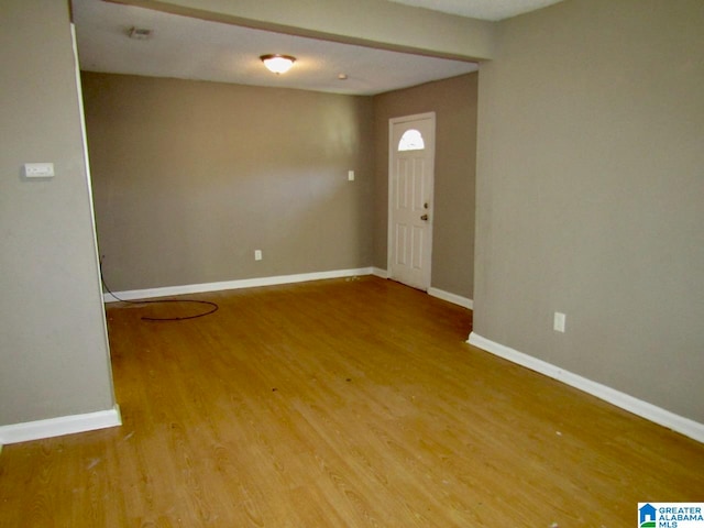 empty room featuring hardwood / wood-style floors