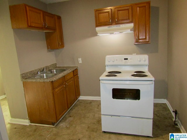 kitchen with white electric range oven and sink