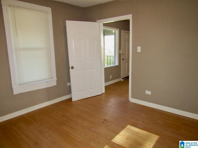 unfurnished bedroom featuring hardwood / wood-style floors