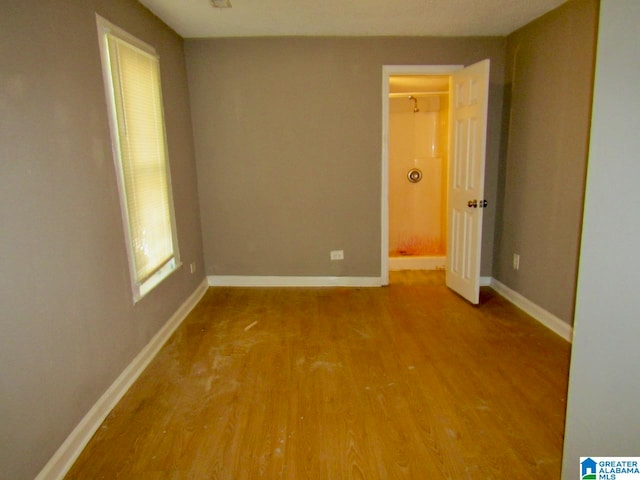 spare room featuring hardwood / wood-style flooring