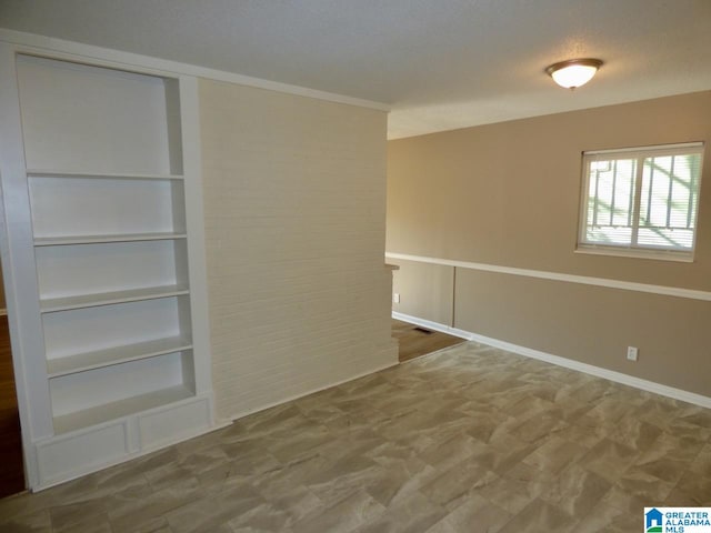 spare room featuring a textured ceiling