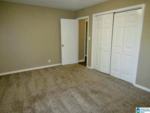 unfurnished bedroom featuring a closet and carpet floors