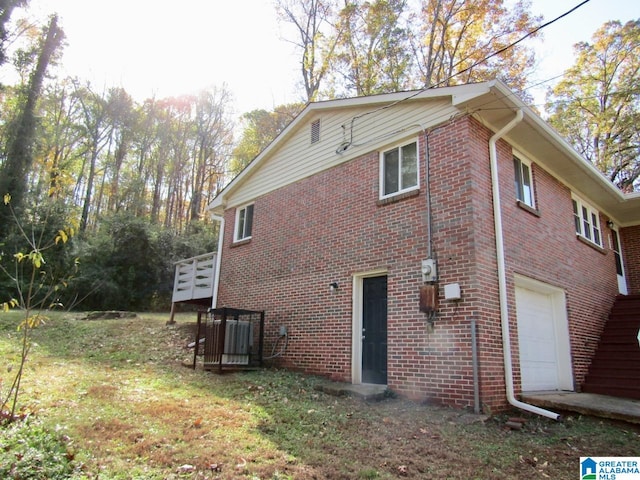 view of side of home featuring a garage