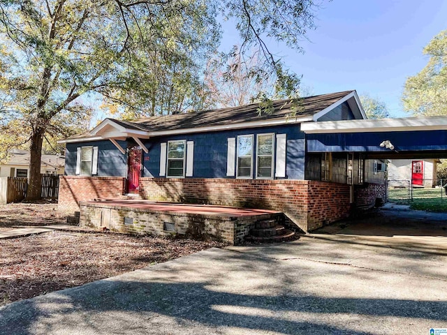 view of front facade with a carport