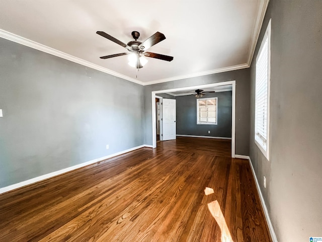 unfurnished room with hardwood / wood-style floors and crown molding