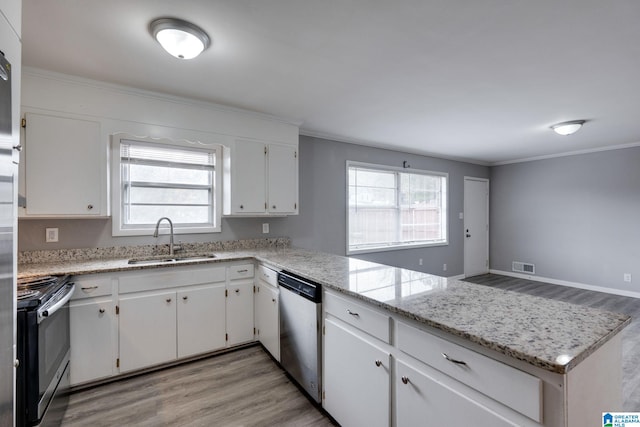 kitchen with white cabinetry, sink, light wood-type flooring, and appliances with stainless steel finishes