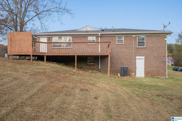 back of house with central AC, a yard, and a deck