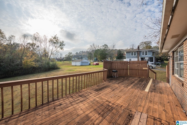 wooden deck with a lawn