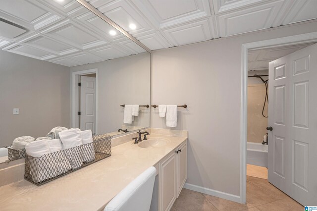 bathroom featuring shower / tub combination, vanity, and tile patterned floors