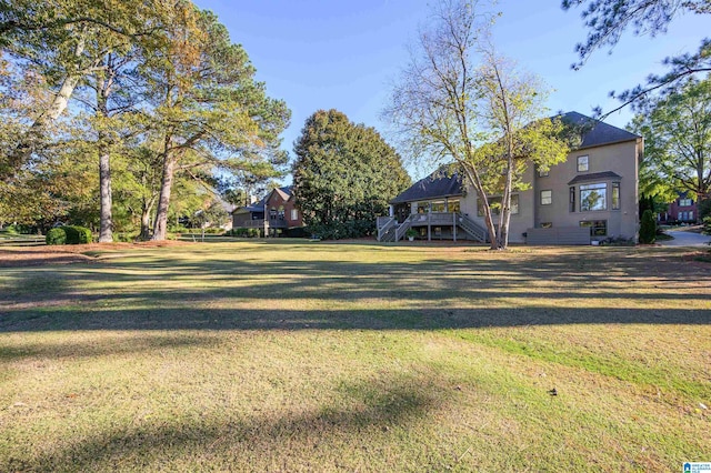 view of yard with a wooden deck